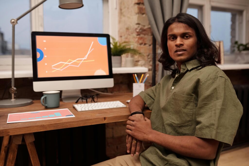 A digital marketing freelancer in India working remotely on SEO and analytics projects using a computer at a modern workspace